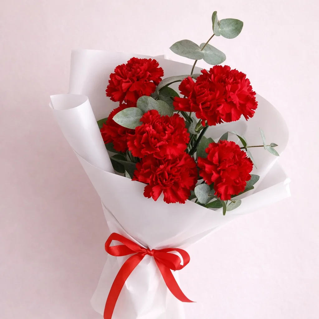 Fuego Clásico - Claveles rojos con eucalipto